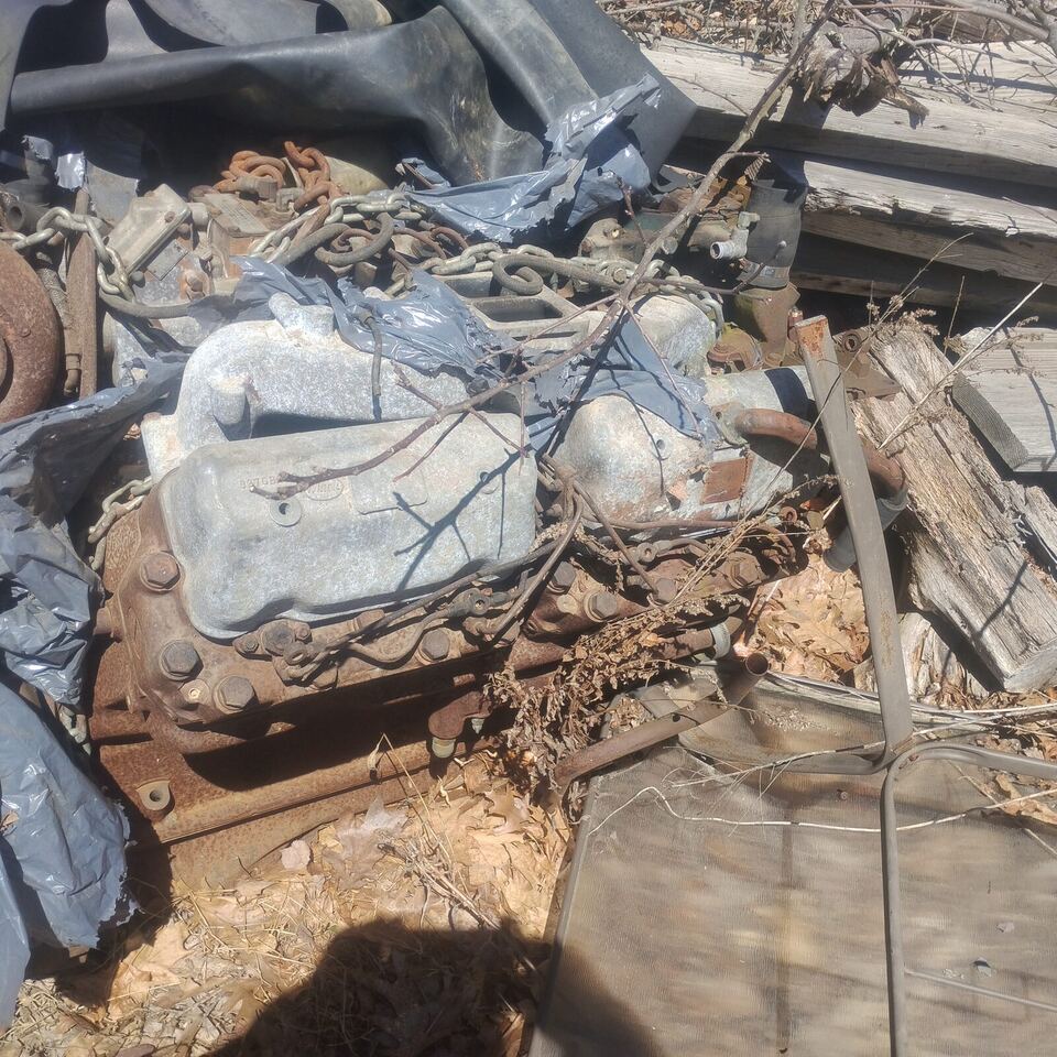 Pile of rusty engines and machinery waiting to be processed as scrap