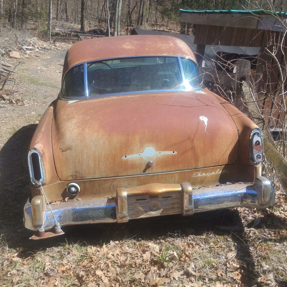 Rusty Chrysler sedan at the yard, headed for scrap